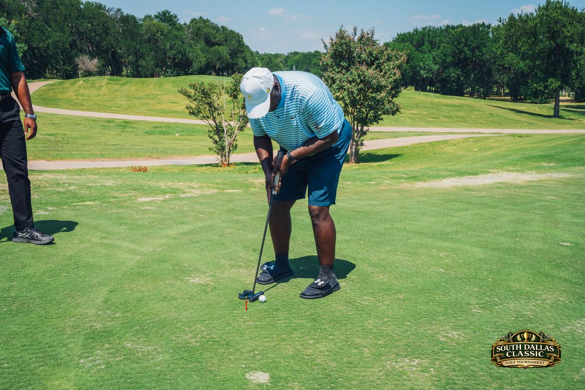 Golfer putting on the green