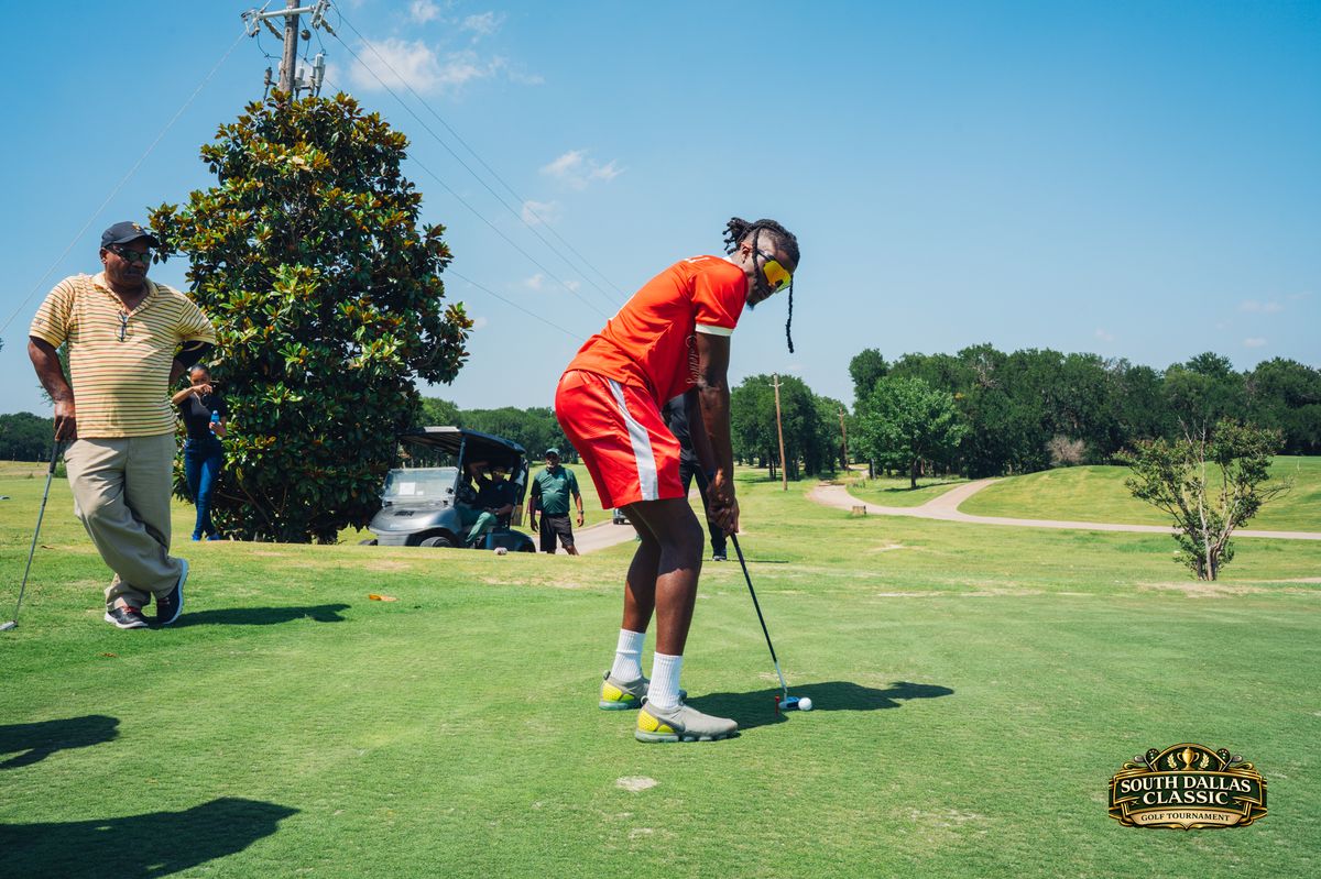 Golfer in red lining up a shot